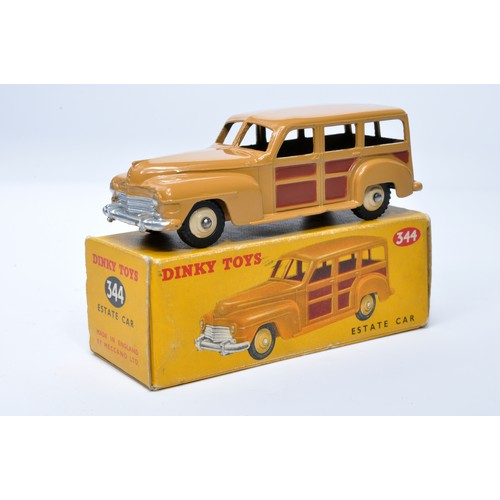 948 - Dinky No. 344 Estate Car. Single issue is in tan and brown, plus beige hubs, as shown. Displays gene... 