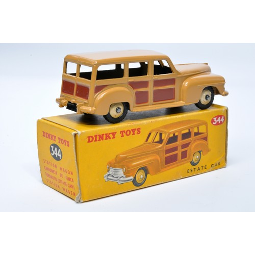 948 - Dinky No. 344 Estate Car. Single issue is in tan and brown, plus beige hubs, as shown. Displays gene... 