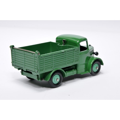 951 - Dinky No. 25m / 410 Bedford End Tipper. Single issue is in darker green, with mid-green hubs, as sho... 