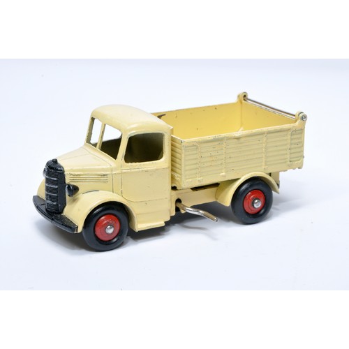 954 - Dinky No. 25m / 410 Bedford End Tipper. Single issue is in cream with red hubs, as shown. Displays g... 