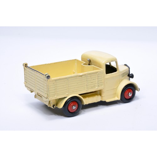 954 - Dinky No. 25m / 410 Bedford End Tipper. Single issue is in cream with red hubs, as shown. Displays g... 