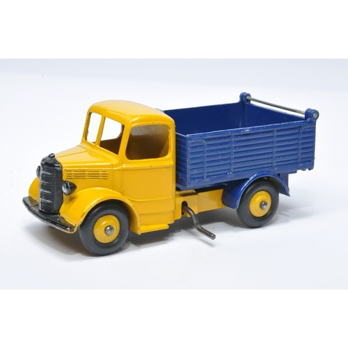 955 - Dinky No. 25m / 410 Bedford End Tipper. Single issue is in yellow / dark blue with yellow hubs, as s... 