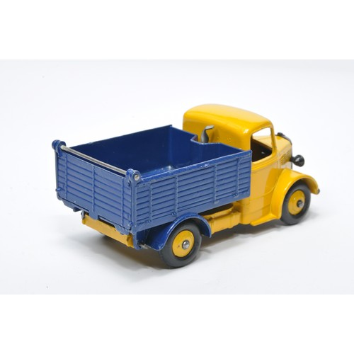 955 - Dinky No. 25m / 410 Bedford End Tipper. Single issue is in yellow / dark blue with yellow hubs, as s... 