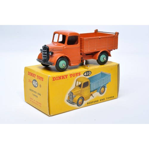 957 - Dinky No. 25m / 410 Bedford End Tipper. Single issue is in orange with green hubs, as shown. Display... 