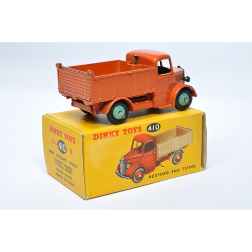 957 - Dinky No. 25m / 410 Bedford End Tipper. Single issue is in orange with green hubs, as shown. Display... 