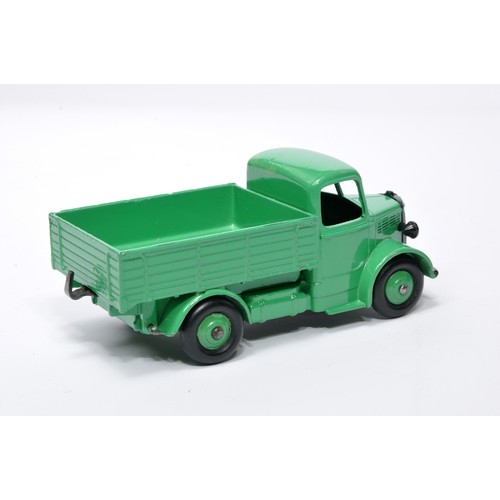 959 - Dinky No. 411 Bedford truck. Single issue is in green with green hubs, as shown. Displays generally ... 