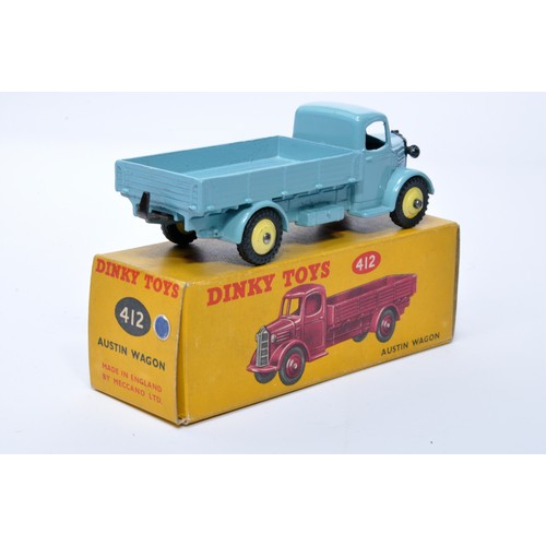 960 - Dinky No. 412 Austin Open Back Wagon. Single issue is in light blue with lemon yellow hubs, as shown... 