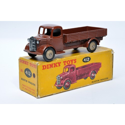 962 - Dinky No. 412 Austin Open Back Wagon. Single issue is in (chocolate) brown with fawn hubs, as shown.... 