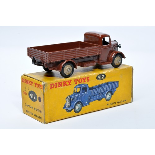 962 - Dinky No. 412 Austin Open Back Wagon. Single issue is in (chocolate) brown with fawn hubs, as shown.... 