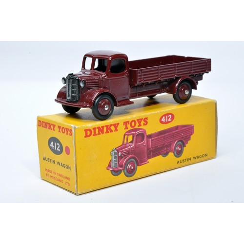 963 - Dinky No. 412 Austin Open Back Wagon. Single issue is in maroon with maroon hubs, as shown. Displays... 