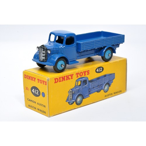 966 - Dinky No. 412 Austin Open Back Wagon. Single issue is in blue with mid-blue hubs, as shown. Displays... 