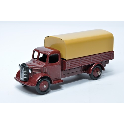 967 - Dinky No. 413 Austin Covered Wagon. Single issue is in dark maroon with dark maroon hubs, as shown. ... 