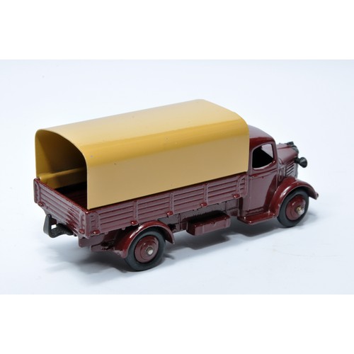 967 - Dinky No. 413 Austin Covered Wagon. Single issue is in dark maroon with dark maroon hubs, as shown. ... 