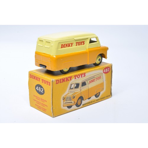 1011 - Dinky No. 482 Bedford Van, Dinky Toys. Single issue is in two-tone tan and yellow, with yellow hubs,... 