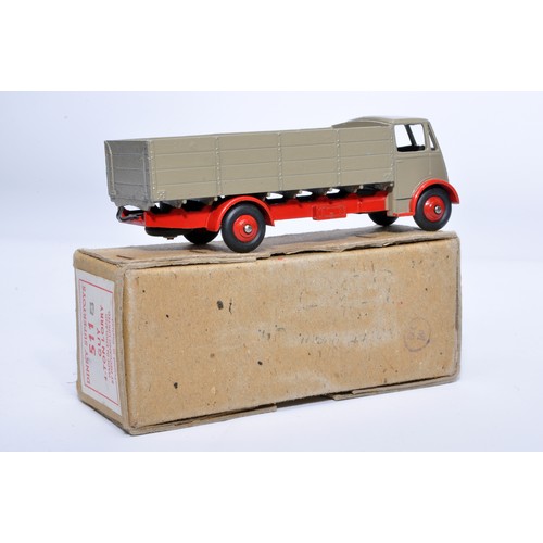 1025 - Dinky No. 511 Guy 4-Ton Lorry. Single issue is in red and fawn, with red hubs, as shown. Displays ge... 