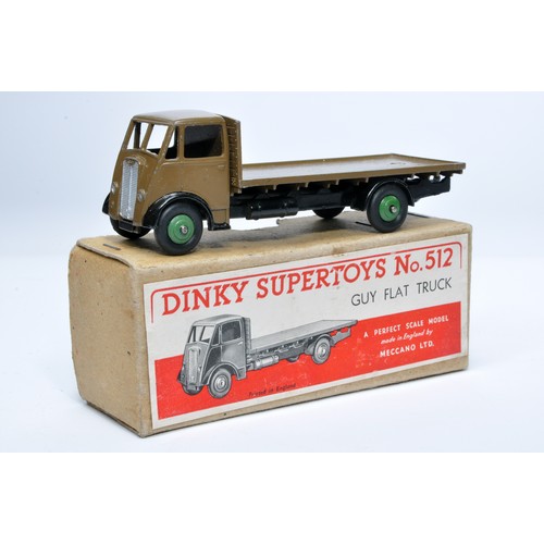 1029 - Dinky No. 512 Guy flat truck. Single issue is in khaki brown, with green hubs, as shown. Displays ge... 