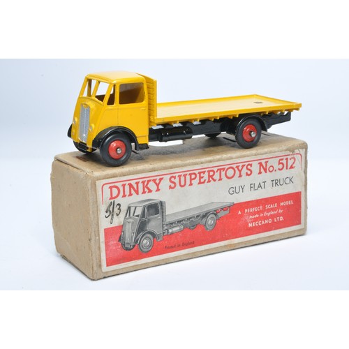 1030 - Dinky No. 512 Guy flat truck. Single issue is in yellow / black, with red hubs, as shown. Displays g... 