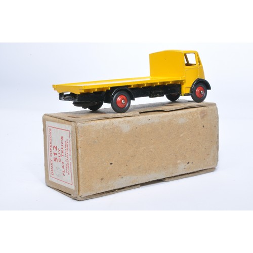 1030 - Dinky No. 512 Guy flat truck. Single issue is in yellow / black, with red hubs, as shown. Displays g... 