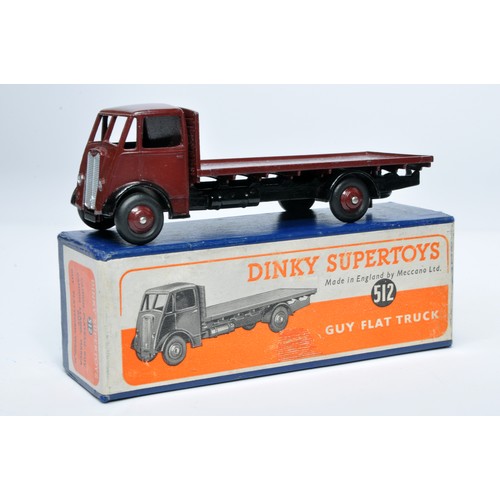 1031 - Dinky No. 512 Guy flat truck. Single issue is in maroon, with maroon hubs, as shown. Displays genera... 