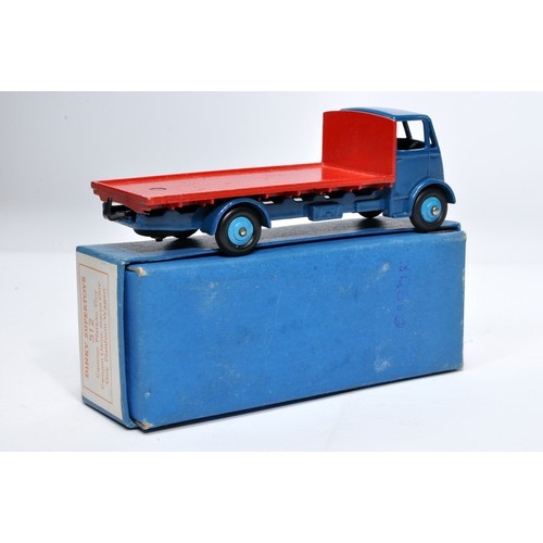 1032 - Dinky No. 512 Guy flat truck. Single issue is in red and blue, with mid-blue hubs, as shown. Display... 