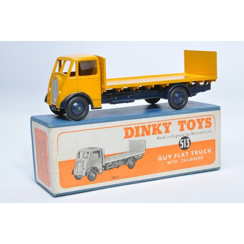 1034 - Dinky No. 513 Guy flat truck with tailboard. Single issue is in yellow / dark blue, with dark blue h... 