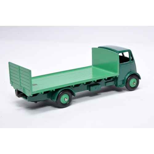 1035 - Dinky No. 513 Guy flat truck with tailboard. Single issue is in two-tone green, with green hubs, as ... 