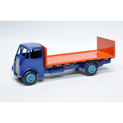 1036 - Dinky No. 513 Guy flat truck with tailboard. Single issue is in blue and orange, with mid-blue hubs,... 