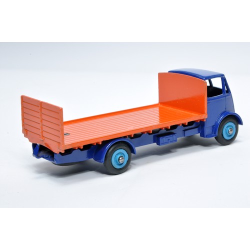 1036 - Dinky No. 513 Guy flat truck with tailboard. Single issue is in blue and orange, with mid-blue hubs,... 