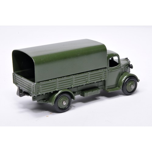 1078 - Dinky Military No. 30SM Austin covered wagon. Displays generally good to very good, with very little... 