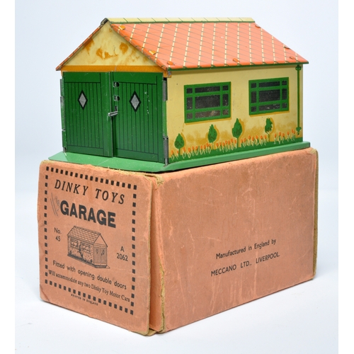 1117 - Dinky early issue set no. 45 tinplate garage. Displays generally good to very good good, with some m... 