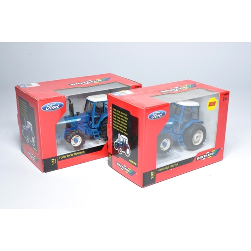 131 - Britains 1/32 farm model duo comprising Ford TW20 and TW30 Tractor issues. Both look to be without o... 