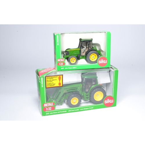 66 - Duo of Siku 1/32 farm model issues comprising John Deere Tractor with Front Loader, excellent in fai... 