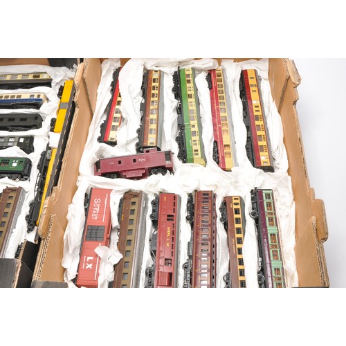 45 - Model Railway comprising a large assortment of rolling stock - coaches / wagons from various makers,... 