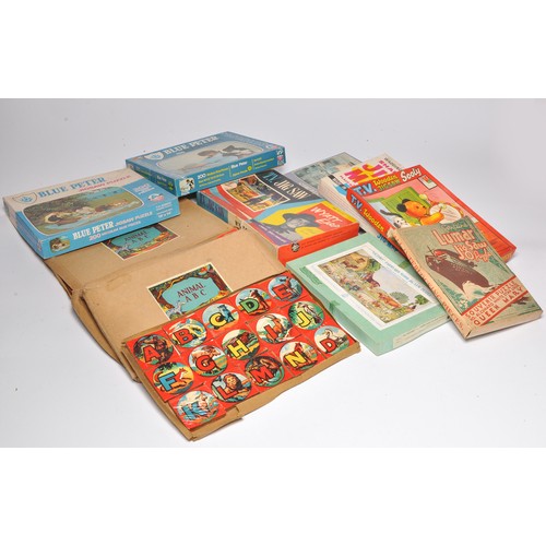 155 - A collection of vintage children's puzzles and games from the 1930's onwards. Alphabet block sets ar... 