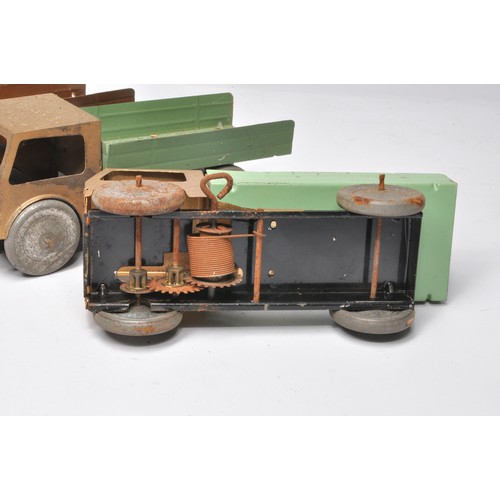 161 - A group of unusual tin/metal Foden type mechanical clockwork tipper lorry issues in various colours,... 