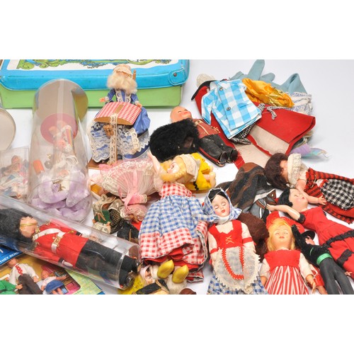 169 - A large collection of vintage fashion and national dolls with clothing, as shown. Various sizes.