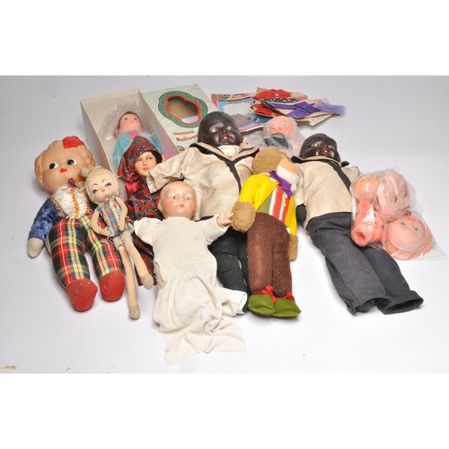 170 - A collection of vintage dolls to include large boxed Chinese national doll plus some early compositi... 