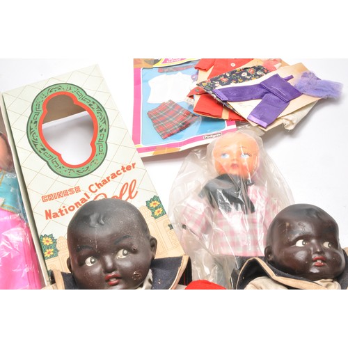 170 - A collection of vintage dolls to include large boxed Chinese national doll plus some early compositi... 