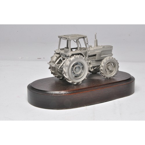 200 - Pewter Ford TW-35 Tractor mounted on a wooden plinth marked Basildon Tractor Production 1984-1989. P... 