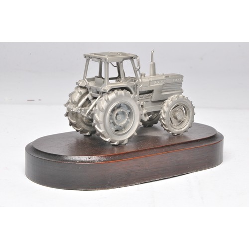 200 - Pewter Ford TW-35 Tractor mounted on a wooden plinth marked Basildon Tractor Production 1984-1989. P... 