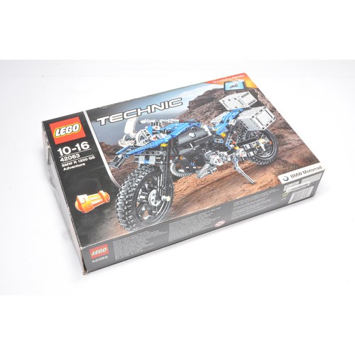 441 - Lego Technic Set comprising 42063, BMW R 1200 GS Adventure, set has been assembled but complete with... 