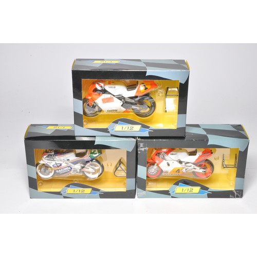 466 - A trio of 1/12 diecast model motorcycles from IXO comprising riders Cadalora, Lawson and Rainey. All... 