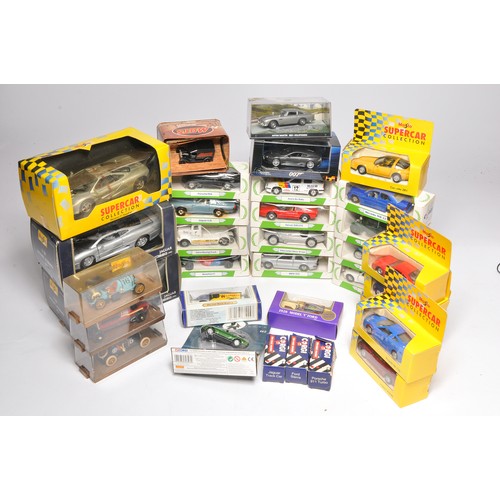 504 - A collection of diecast models comprising various 'giveaway' token models plus others including Mini... 