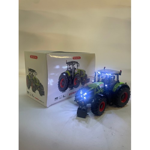 21 - Farm Model Issue comprising 1/32 Wiking Claas Axion 950 in original box and packaging. Model has bee... 