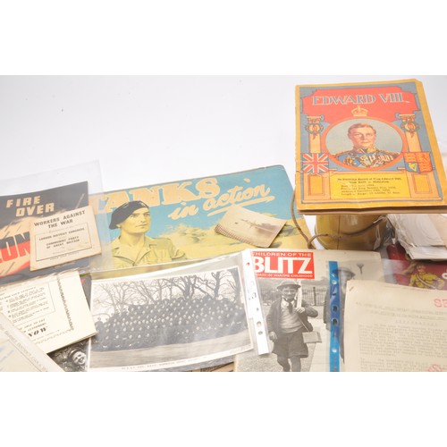 25 - An interesting collection of war time ephemera comprising paperwork, leaflets, publications and othe... 