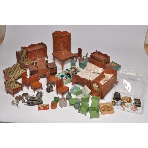 62 - An attractive assortment of Dolls' house furniture, some larger scale, as shown.