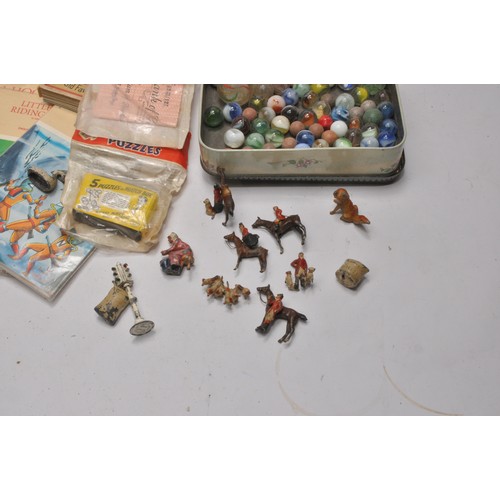 84 - An interesting group of vintage children's toys including figures (hunt, Llama ride set (complete) a... 