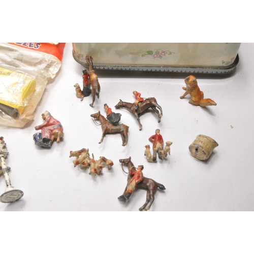 84 - An interesting group of vintage children's toys including figures (hunt, Llama ride set (complete) a... 