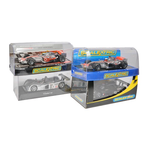 462 - Scalextric slot car issues comprising Vodafone McLaren Mercedes, McLaren Mercedes MP4-21, Cadillac L... 