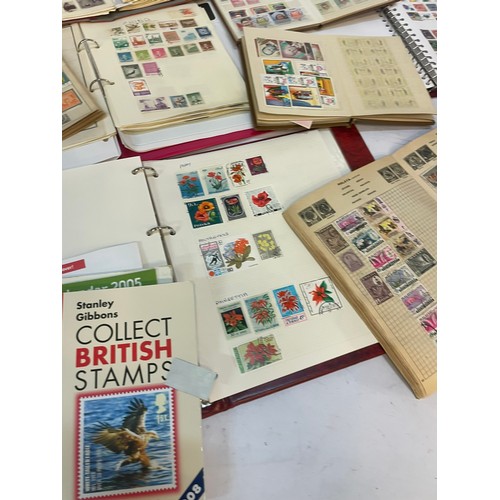 602 - A varied collection of stamps comprising several albums containing used and unused examples from aro... 